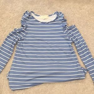 long sleeve shirt with a ruffled cold shoulder.